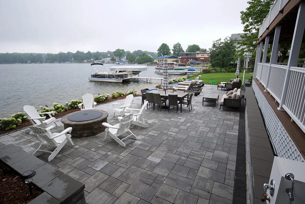 Lakeside patio with fire pit and Adirondack chairs, Southwest Michigan lake property