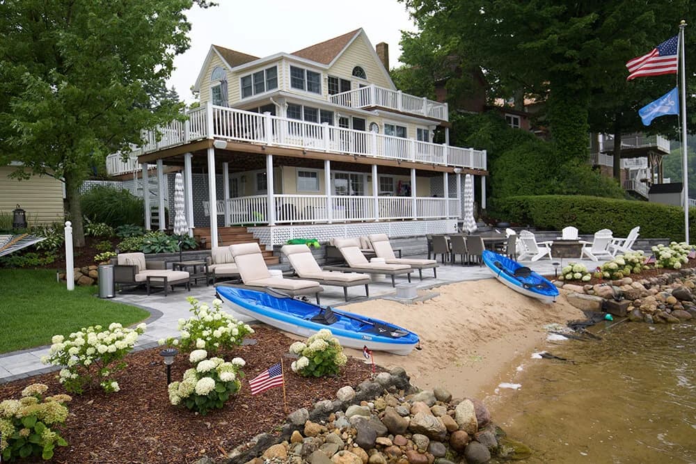 Lake house shoreline with sandy beach, Southwest Michigan water property